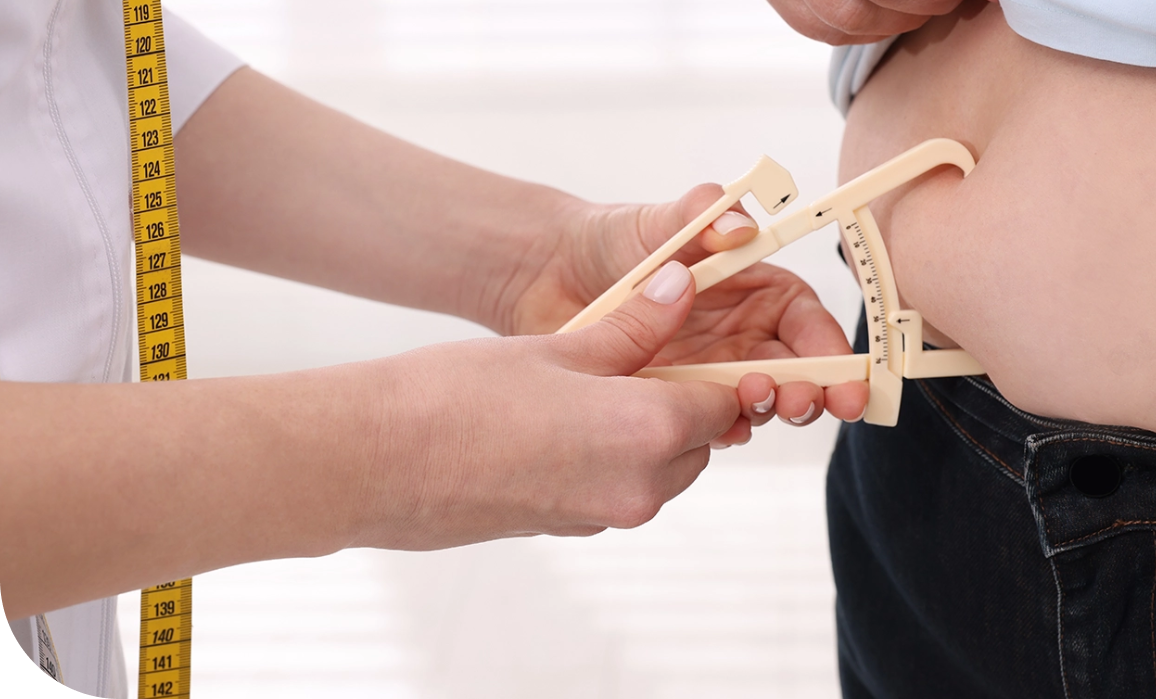 A person measuring the arm of another person.